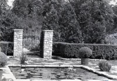 Morton residence lily pool with hedge and stone gateway
