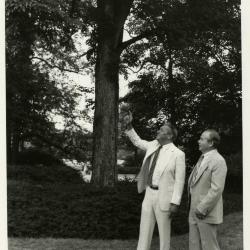 Byron Turnquest pointing at tree with George Ware during presentation of check for $125,000 to The Morton Arboretum by ARCO