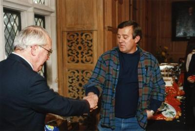 George Ware Retirement Party in Founders Room - George Ware (left) and Doug Monroe shaking hands
