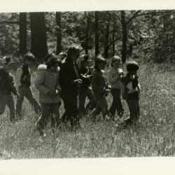 Morton Arboretum Guide, Alice Burkman, with school group of children in the woods