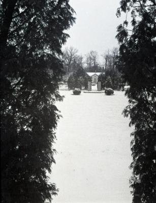 Winter view of small building at rear of Morton residence garden