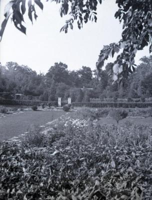 Morton residence garden toward hedge and stone pillars