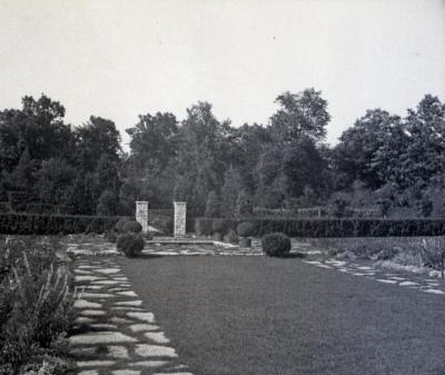 Morton residence hedge around garden bordered with stone path