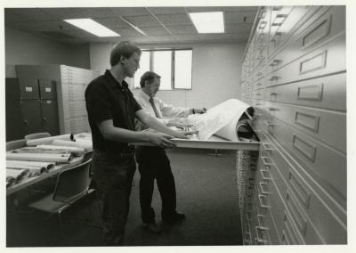 Rick Hootman and Joe Larkin reviewing maps and plans in the new Map Room