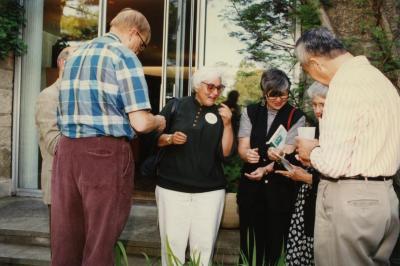 Green Nature, Human Nature book signing in Sterling Morton Library, group of guests in conversation in the May T. Watts Reading Garden