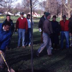 Gerry Donnelly with shovel at Arbor Day employee tree planting