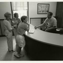 Ed Hedborn assisting visitors at Plant Clinic desk