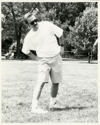 Dr. Gerry Donnelly warming up for volleyball at employee summer picnic near the Research Building