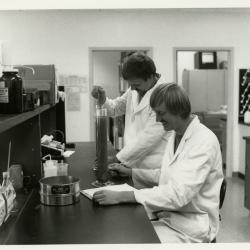 Pat Kelsey (left) and Rick Hootman soil testing in the lab
