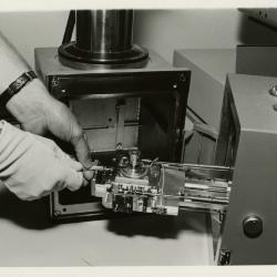 Scanning Electron Microscope (SEM) research - William Hess placing the coated specimen on stage into the specimen chamber