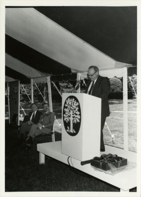 Tony Tyznik Retirement Party in tent - Charles Haffner addressing guests from podium - (Seated L to R): Tony Tyznik, Gerry Donnelly