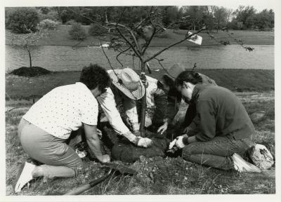 Earth Day - group planting tree near lake (L to R): Nina Hoppe, Charles Lewis, Lynn Kalata, unidentified person, Rita Hassert