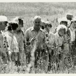 Ray Schulenberg (center) and students in the Schulenberg Prairie