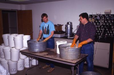 Salt Study, Pat Kelsey (right) and Rick Hootman (left) washing buckets in research lab
