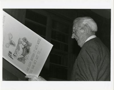 Clarence E. Godshalk's 90th birthday party, reading his birthday card