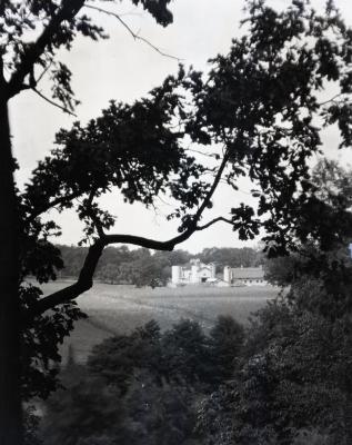 Rogers Farm on Park Blvd. as viewed through trees from Ridge Road