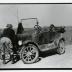Clarence E. Godshalk with Model T car and dog Punch