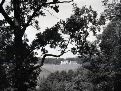 Rogers Farm on Park Blvd. viewed through trees from Ridge Road
