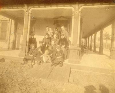 J. Sterling Morton, 4 sons and extended family sitting on Arbor Lodge porch