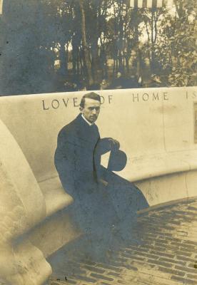 Memorial dedication in honor of J. Sterling Morton at Arbor Lodge, man sitting on curved bench