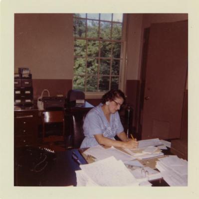 Edna Jones working at desk