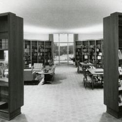 Sterling Morton Library, reading room, through curved bookshelves toward Reading Garden