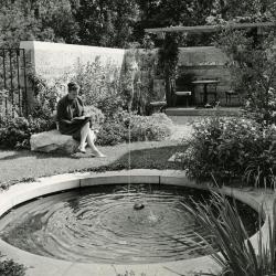May T. Watts Reading Garden, Suzette Morton Zurcher seated near fountain