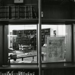 Sterling Morton Library, reading room, view of center through curved bookshelf glass window