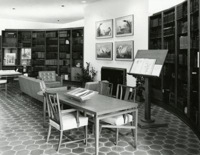 Sterling Morton Library, reading room, displays on tables and easel before fireplace