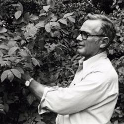 Ray Schulenberg studying plant outside
