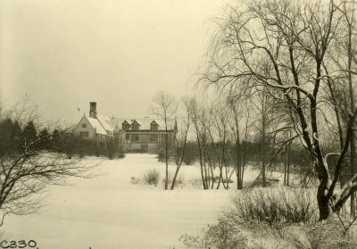 Looking east over small pond to Morton Residence at Thornhill in winter