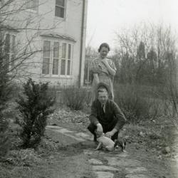 Clarence and Margaret Godshalk outside with several of their puppies