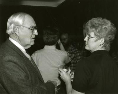 Clarence E. Godshalk's 90th birthday celebration scrapbook: Walter Eickhorst talking with Nancy Eickhorst