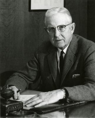 Clarence E. Godshalk at his desk, 68 years old