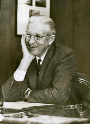 Clarence E. Godshalk at his desk, 68 years old
