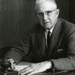 Clarence E. Godshalk at his desk, 68 years old