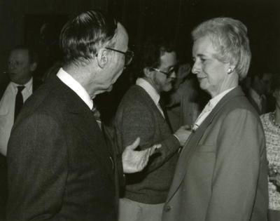 Clarence E. Godshalk's 90th birthday celebration scrapbook: Marion Hall talking with Helen Langrill