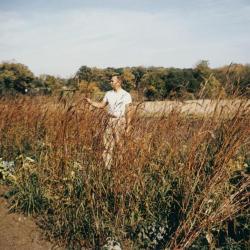 Ray Schulenberg in fall prairie with big bluestem