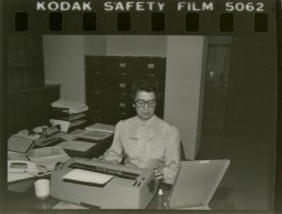 Kathy McNulty in office (contact print)