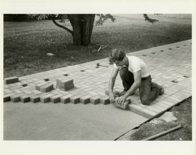 Scott Moberg laying bricks for the Display Garden path