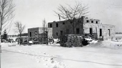 Administration Building construction in winter, side and rear view