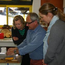 Nicole Cavender and Murphy Westwood observing lab equipment at the French National Institute for Agricultural Research
