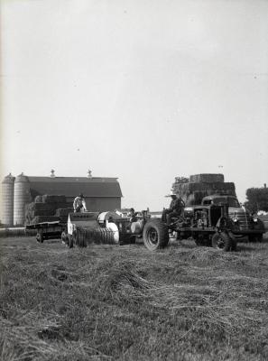 Men baling hay at Lisle Farms
