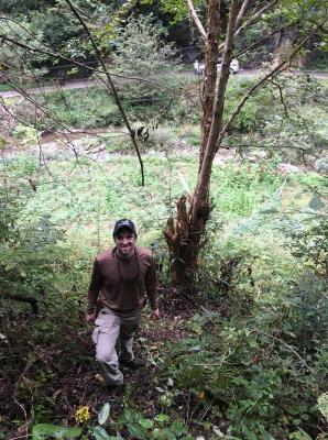 Matt Lobdell standing near Corylus fargesii (paperbark hazelnut)