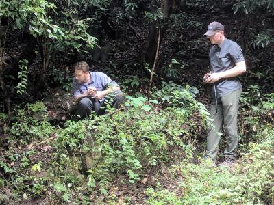 Peter Zale and Andrew Gapinski examining plants