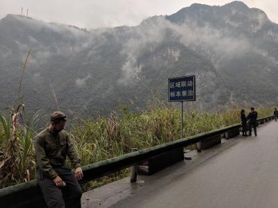 Peter Zale on guardrail during traffic stop in Western Hubei