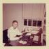 Floyd Swink in office at typewriter