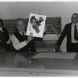 Dr. George Ware with 100,000th Herbarium specimen