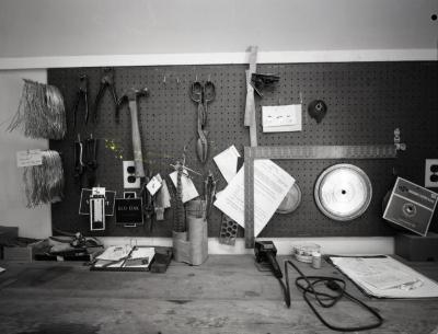 Sign Shop, pegboard and workbench with tools