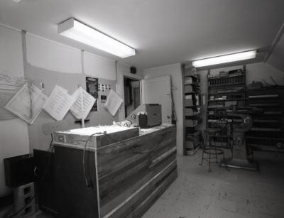 Sign Shop, work station with bulletin board